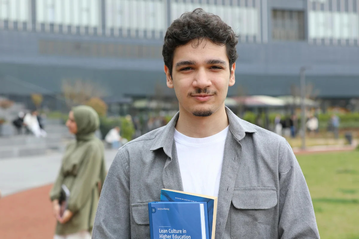 Results student holding book